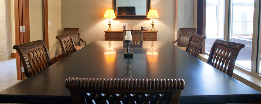 meeting room with a table and chairs and a glass window